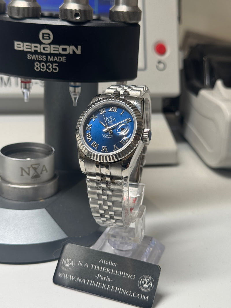 Lady Classic Date / N.A / 31 mm lunette cannelée cadran Romain Bleu océan